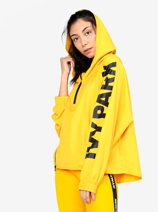 Žlutý šusťákový anorak s kapucí Ivy Park